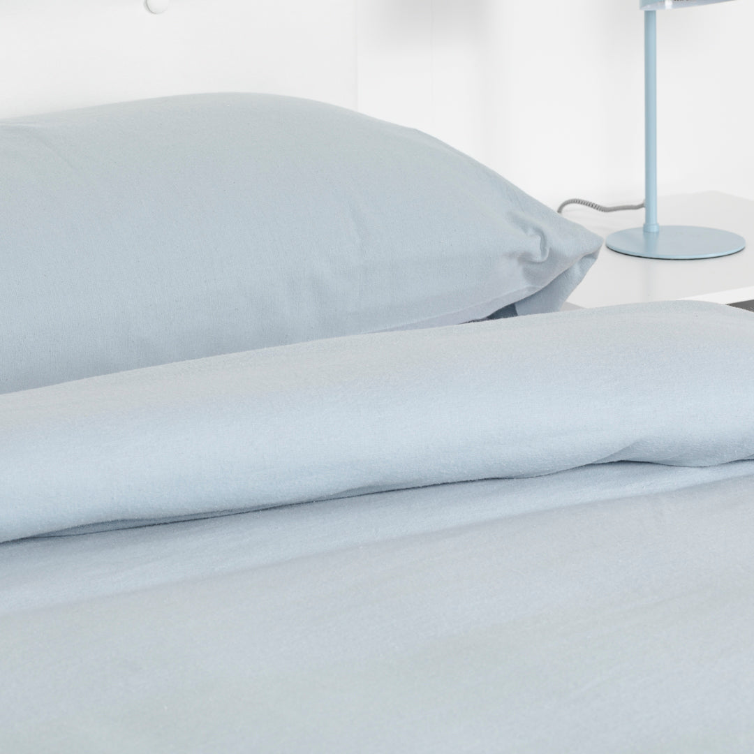 Housse de couette en flanelle bleu clair uni