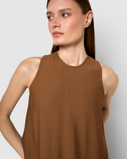 long, sleeveless, flowing brown dress