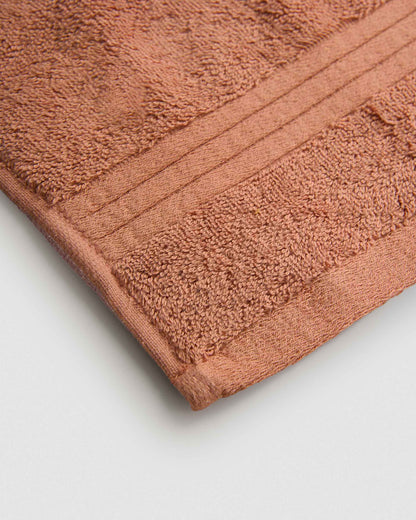 Serviette de bain 700gr bordure rayée caldera