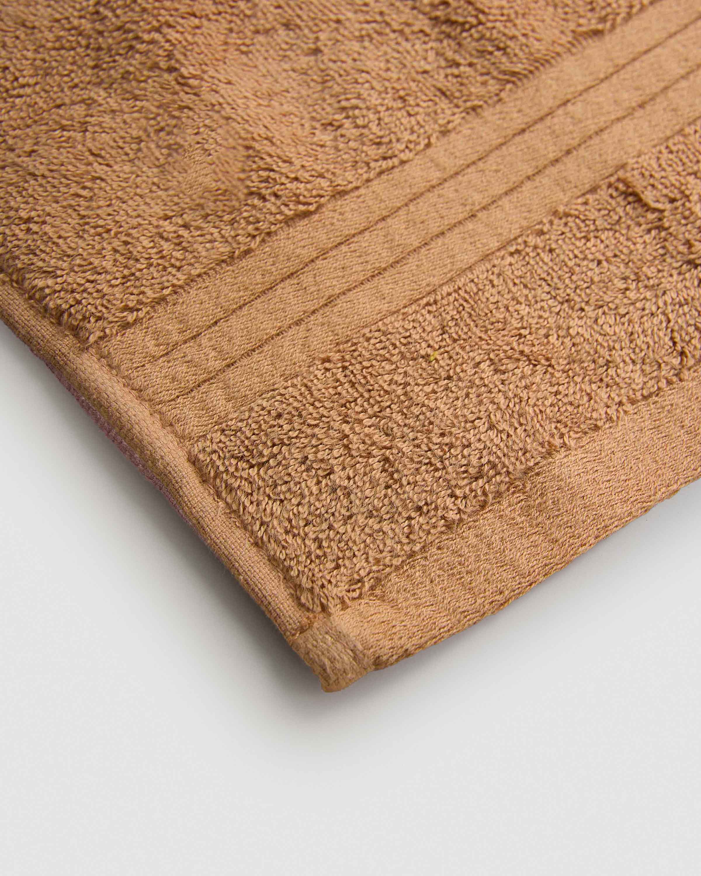 Toalla de baño 700gr cenefa rayas ocre