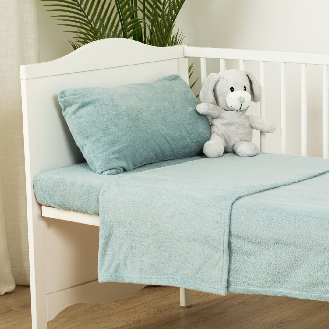 Plain coral fleece crib sheet set