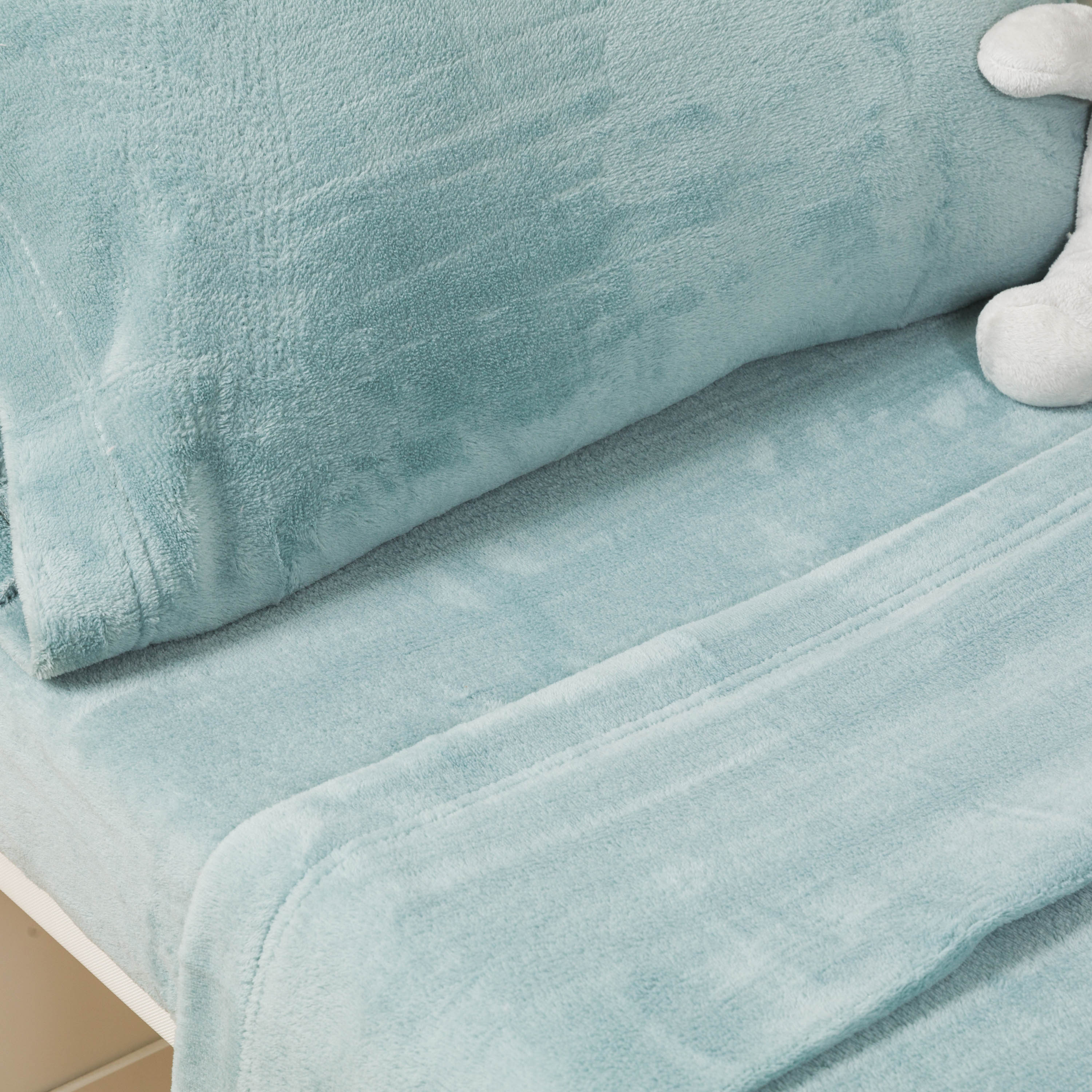 Plain coral fleece crib sheet set