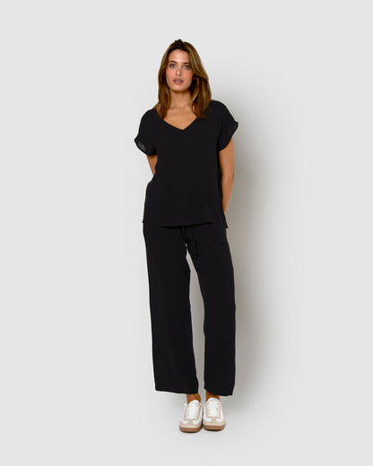 Women's long trousers in black viscose and chambray fabric