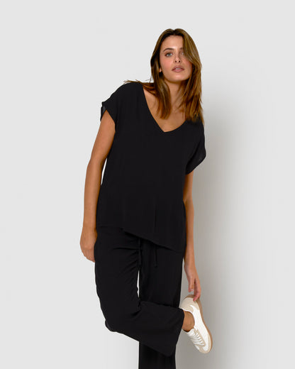 Women's long trousers in black viscose and chambray fabric